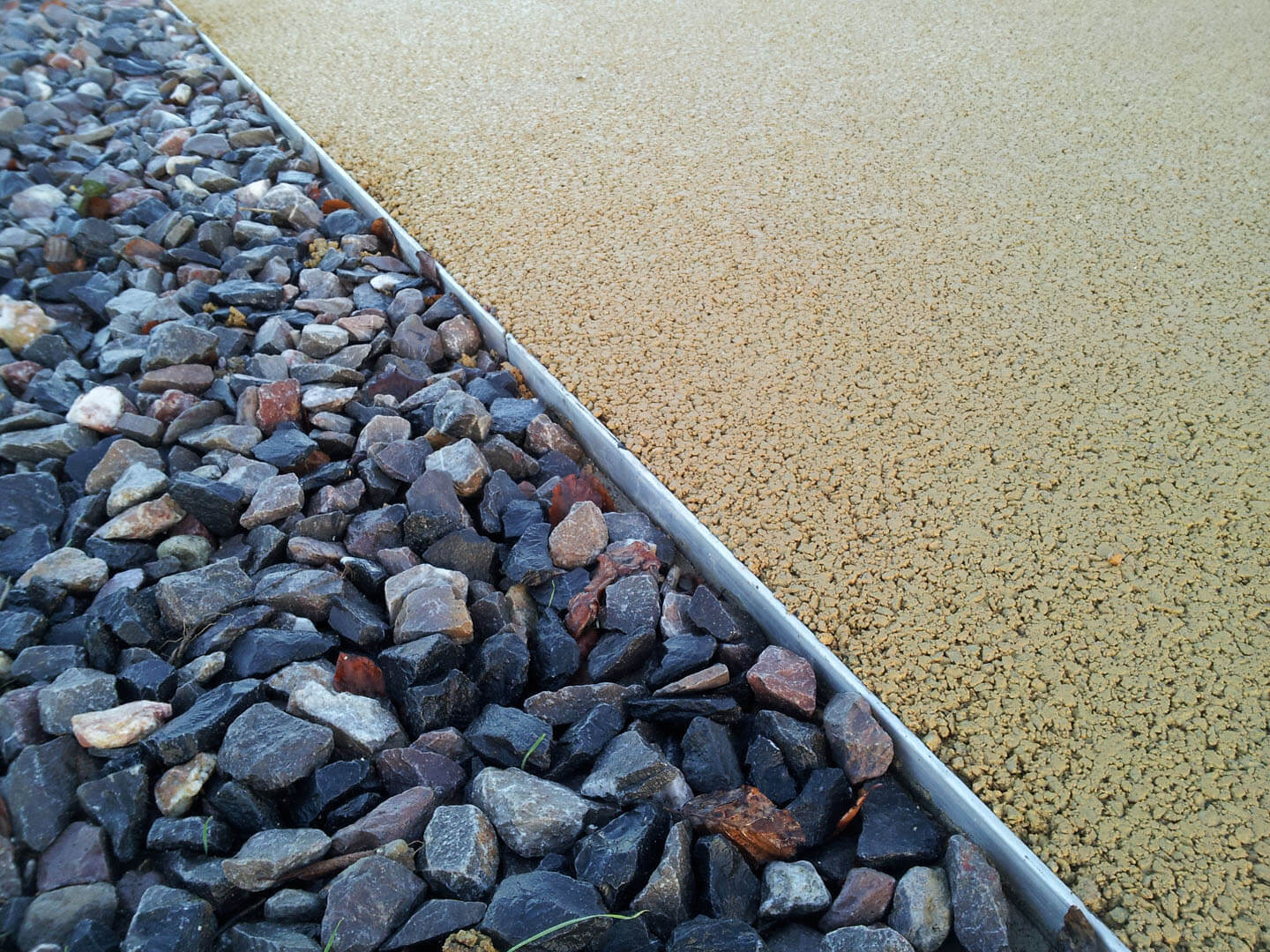 Gravel driveway with resin driveway